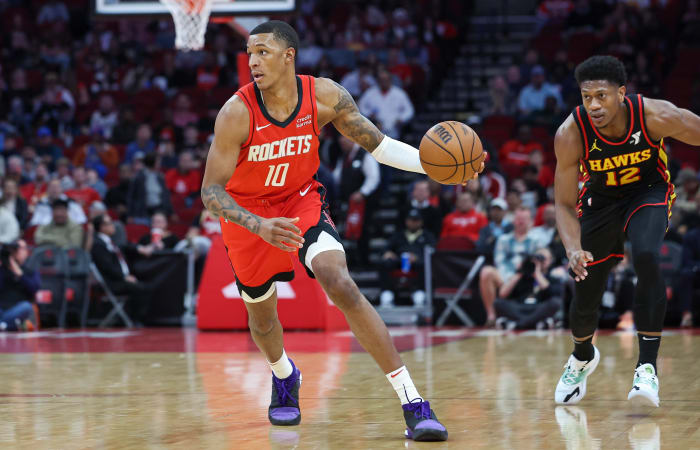 Rockets forward Jabari Smith Jr. dribbles the ball during the first quarter against the Atlanta Hawks at Toyota Center.